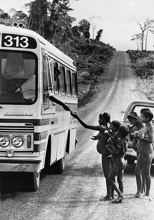 26th March 1964: Members of the Krain-a-Kores tribe in Brazil investigating a bus on the road which passes through their territory. Only recently introduced to Western civilisation, people of the tribe often beg sweets from passengers. (Photo by Keystone Features/Getty Images)